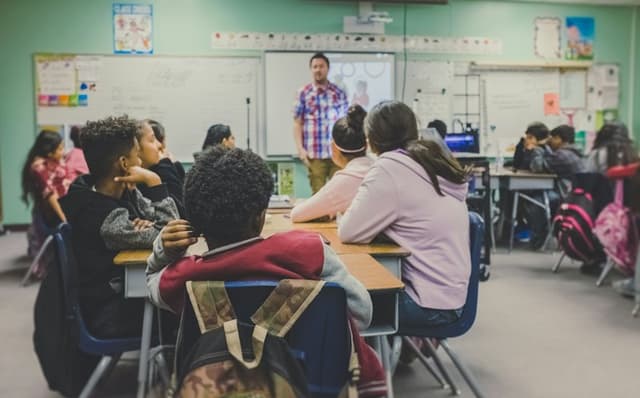 A teacher leading a lesson with pupils